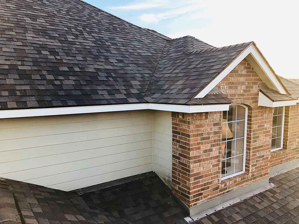 Residential House with New Roof Shingles