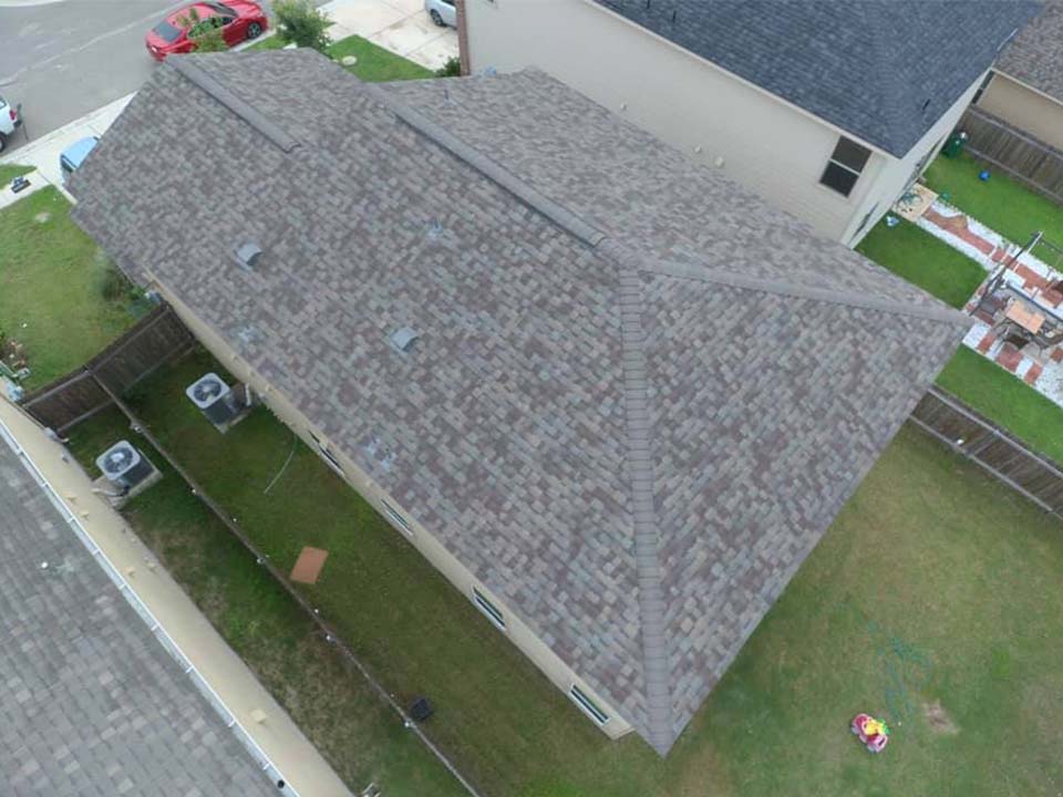 Residential House with New Roof Shingle Installation