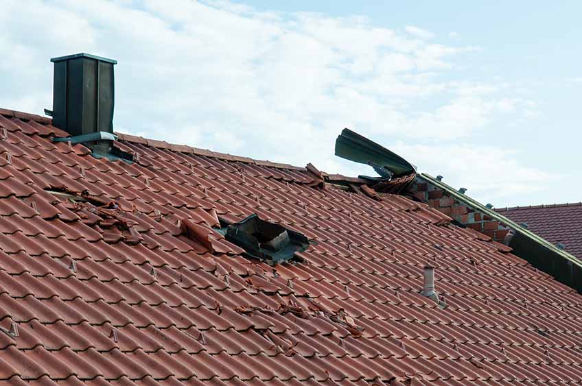 Damaged roof after storm Damaged roof after storm