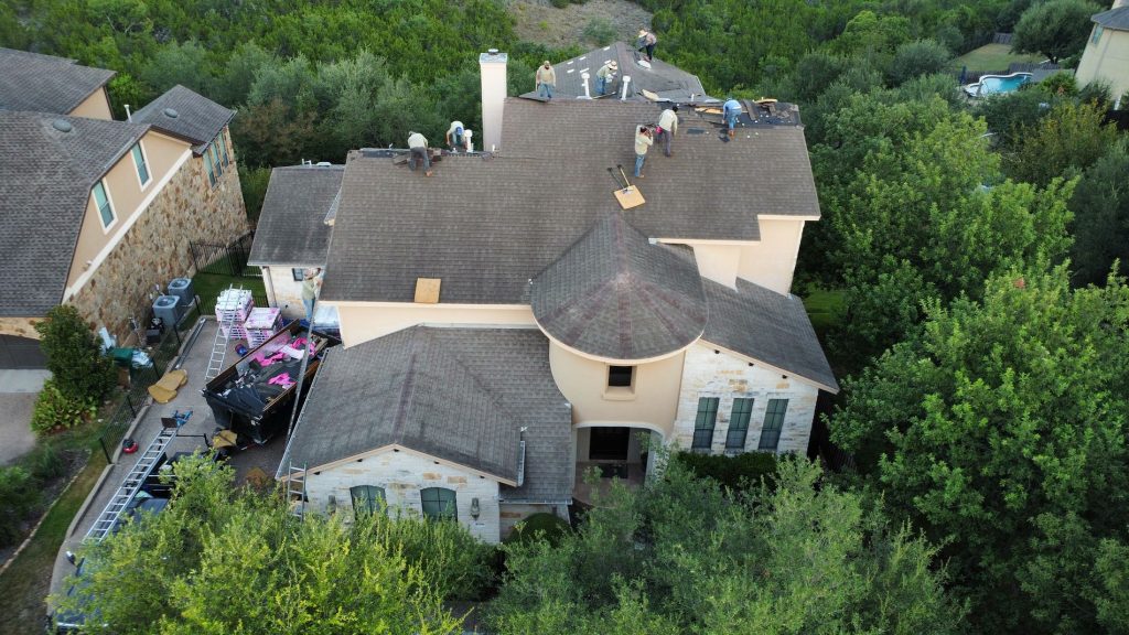 Drone photo showing hail impact marks on asphalt shingles in Round Rock, TX